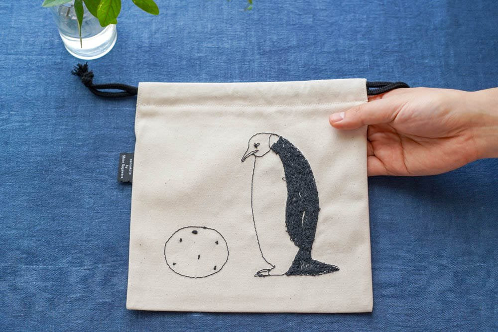 sennokoto by Shion Sugawara | 巾着 - 両面刺繍 親子ペンギン & ミカン